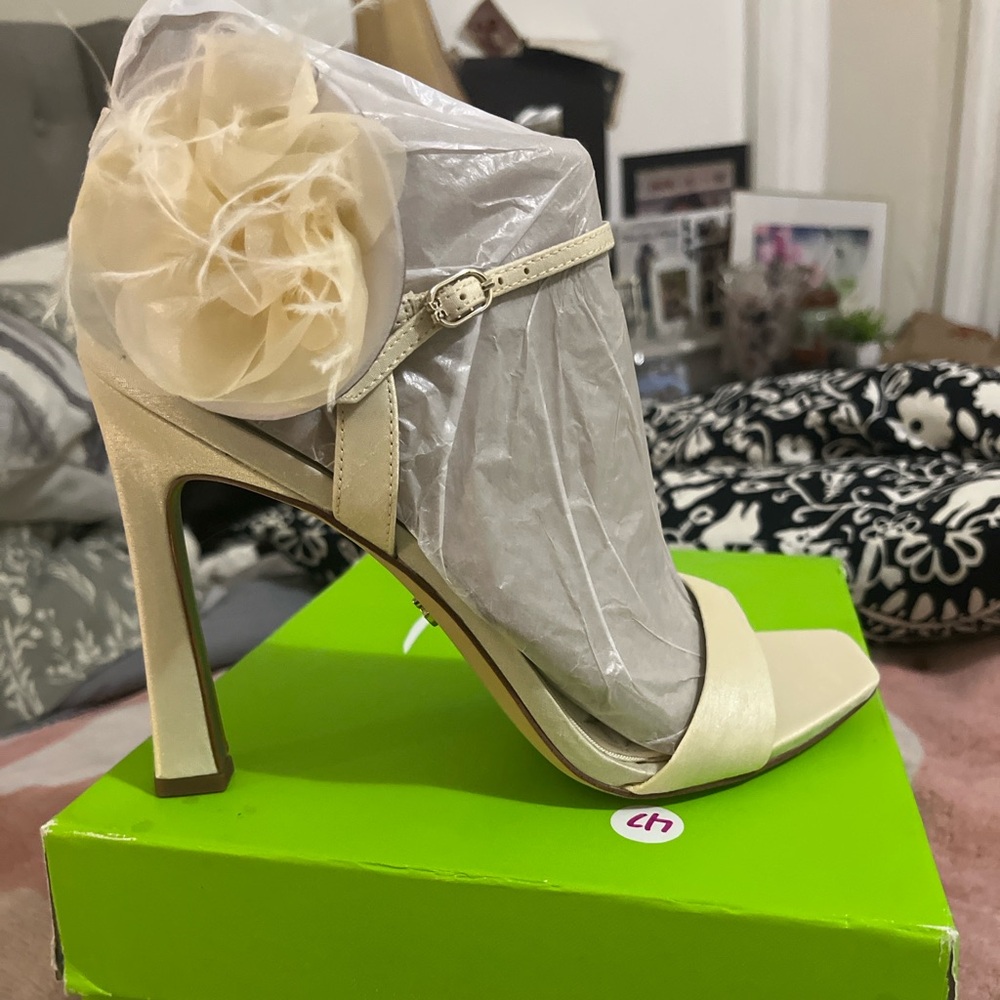 Ivory Silk Heels with Flower on the side.